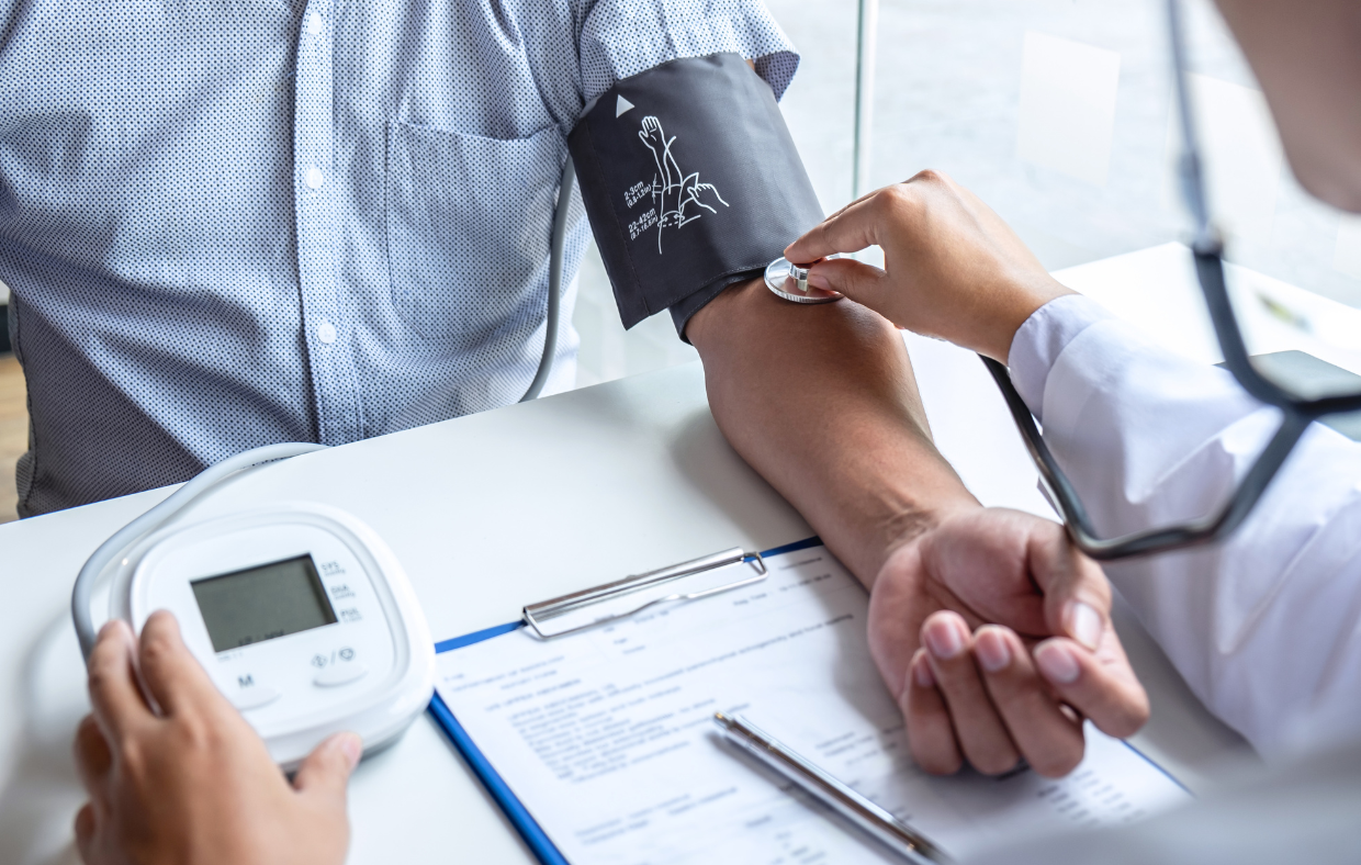 Photo of a patient having their blood pressure monitored for hypertension management.