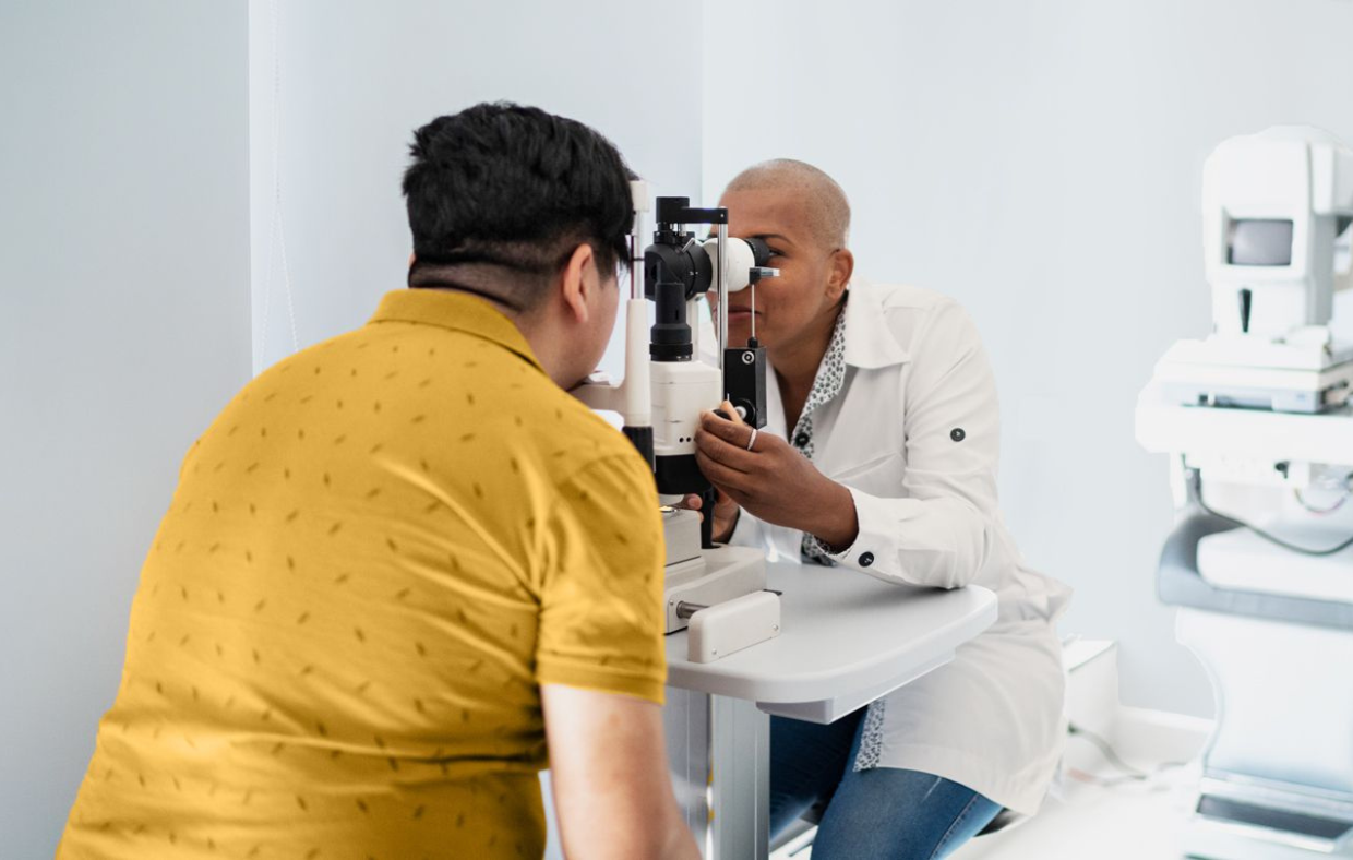 Photo of a doctor doing an eye exam for diabetic retinopathy.