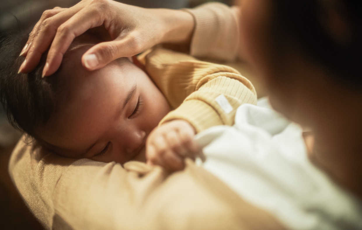 Photo of a mother and baby breast feeding showing the benefits.